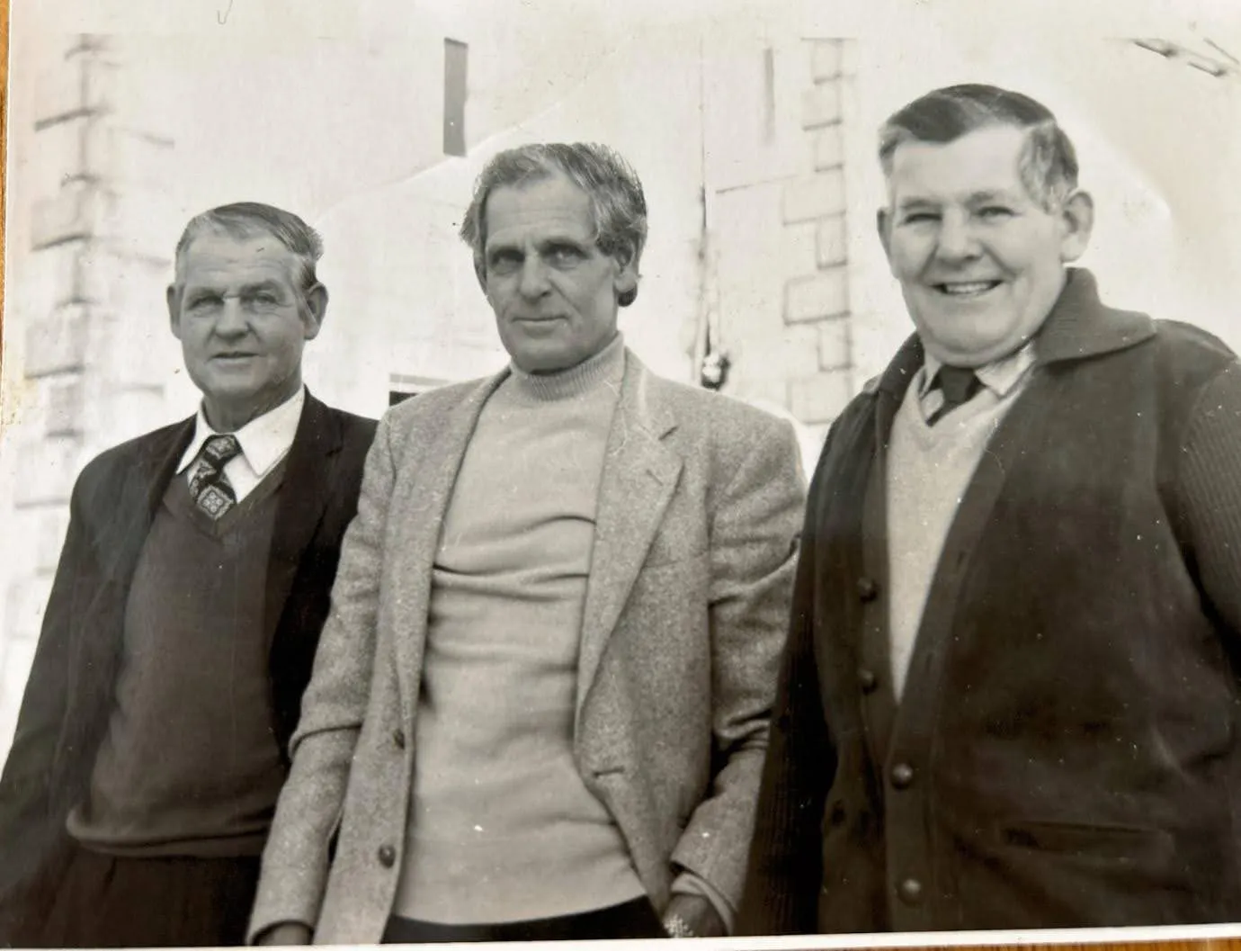 A group of men standing next to each other.